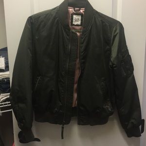 Army green moto jacket with pink lining.